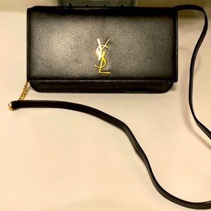 Black Saint Laurent monogram phone shoulder bag.